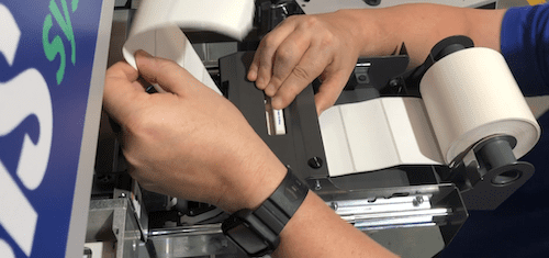 Pull 8 labels out of the back side of the printer