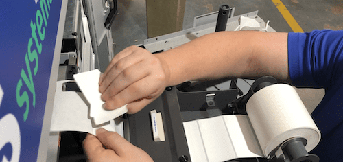 Remove 9 labels saving 1 for the take up core